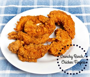Hot crispy chicken strips on a white plate