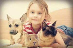 child and a cat and a dog and guinea pig in a retro style